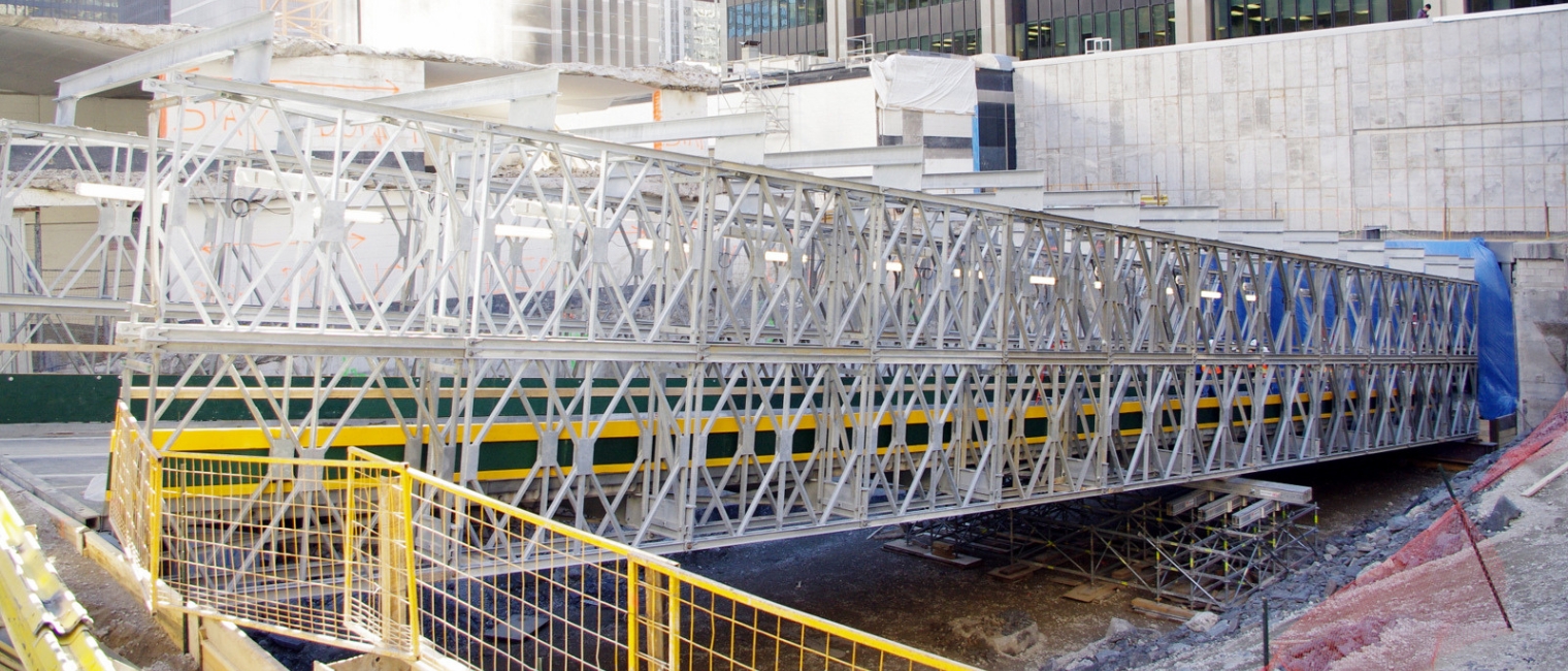 Prefabricated Modular Steel Bridge with Protective Roof Maintains Local Commerce