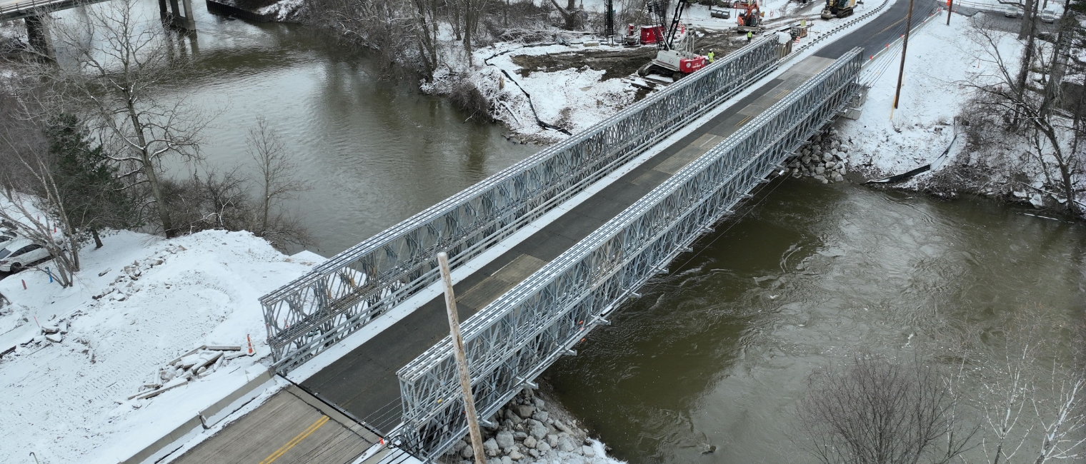 Durable modular bridge installed in tight build area to carry oversized loads